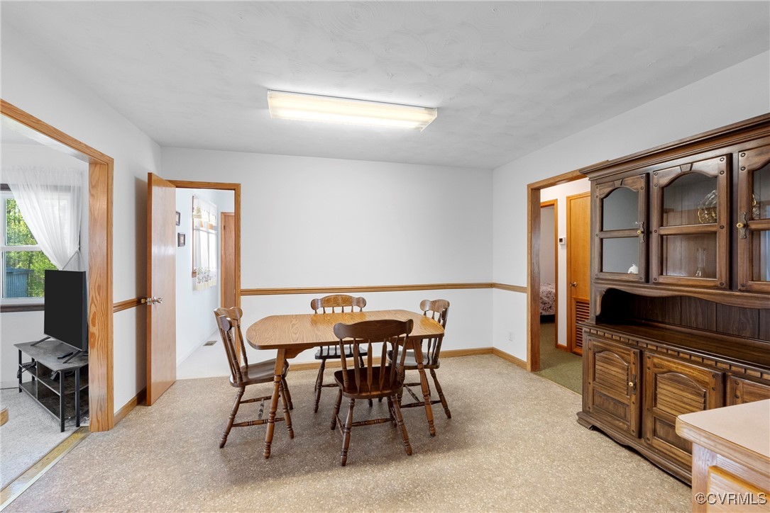 5290 Crumptown Road Farmville, VA 23901 - Photo 5 of 43 a view of a dining room with furniture and a window
