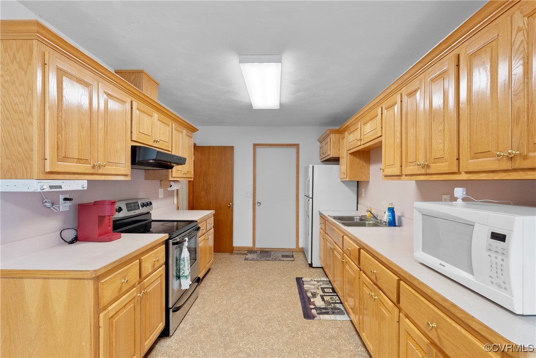 5290 Crumptown Road Farmville, VA 23901 - Photo 6 of 43 a kitchen with stainless steel appliances a sink a stove and cabinets