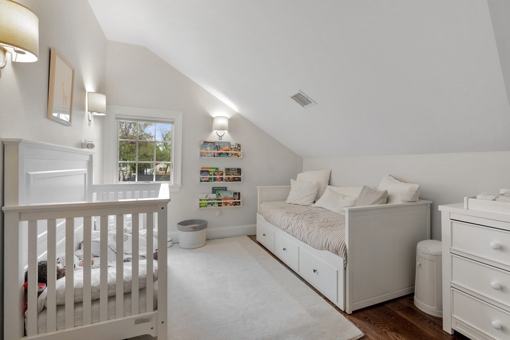 271 Chestnut Street Newton, MA 02465 - Photo 17 of 28 a spacious bedroom with a bed and a window