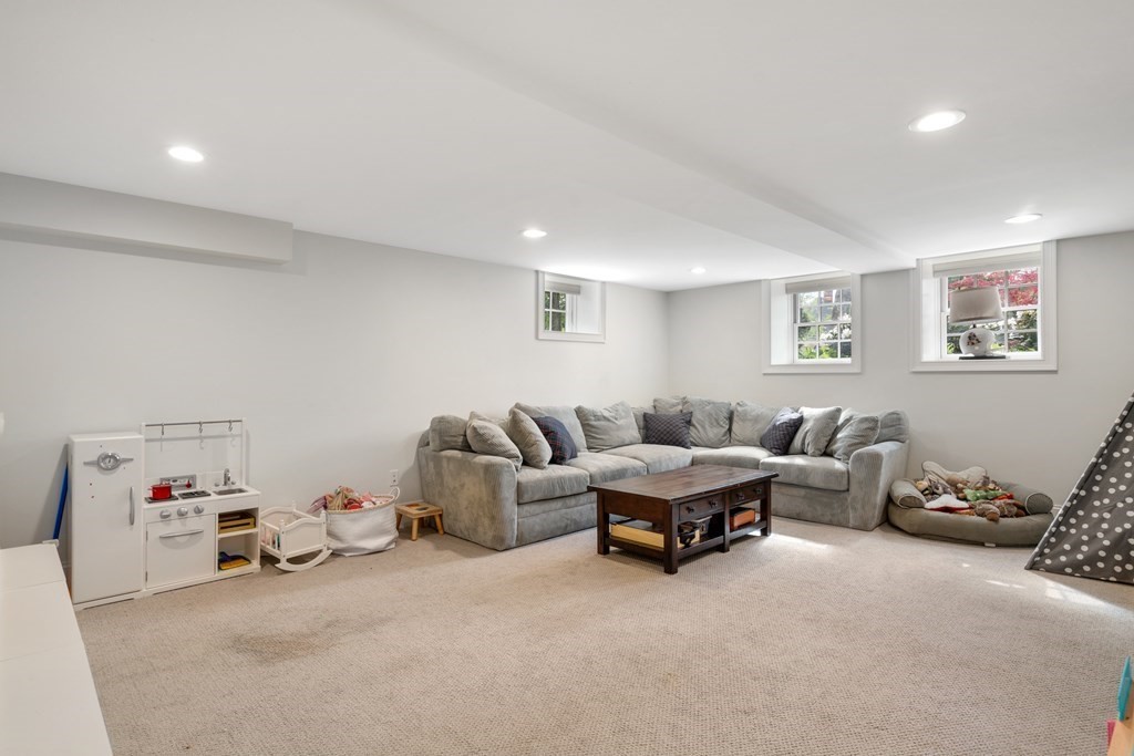 271 Chestnut Street Newton, MA 02465 - Photo 20 of 28 a living room with furniture and a window