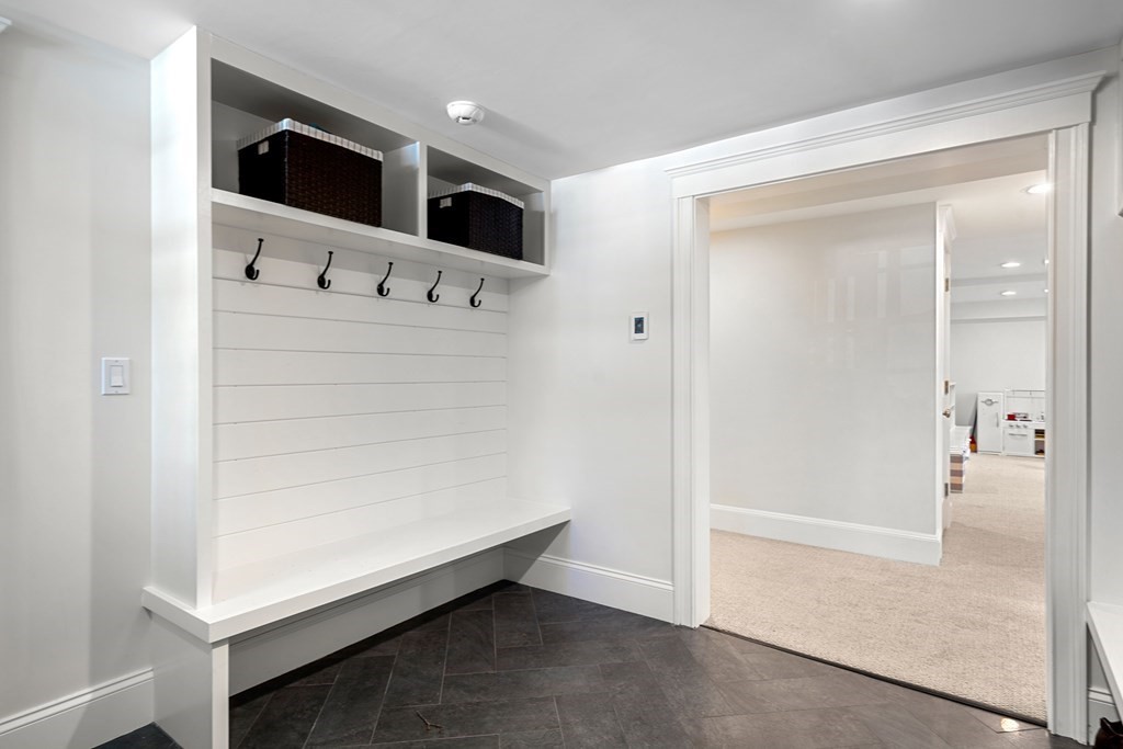 271 Chestnut Street Newton, MA 02465 - Photo 22 of 28 a bathroom with a double vanity sink and mirror