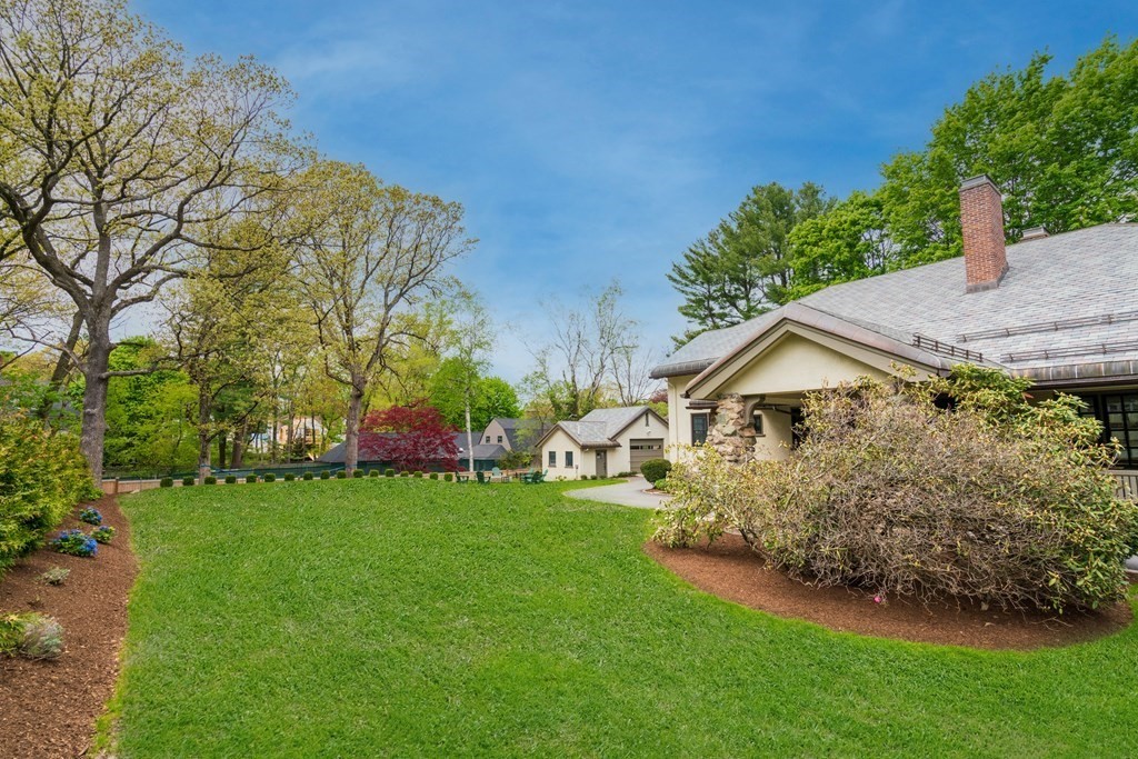 271 Chestnut Street Newton, MA 02465 - Photo 24 of 28 a front view of a house with a garden