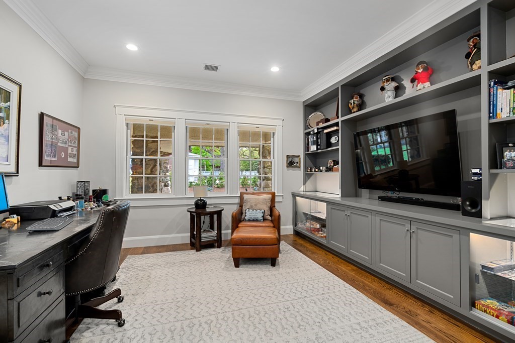 271 Chestnut Street Newton, MA 02465 - Photo 9 of 28 a living room with furniture and a flat screen tv