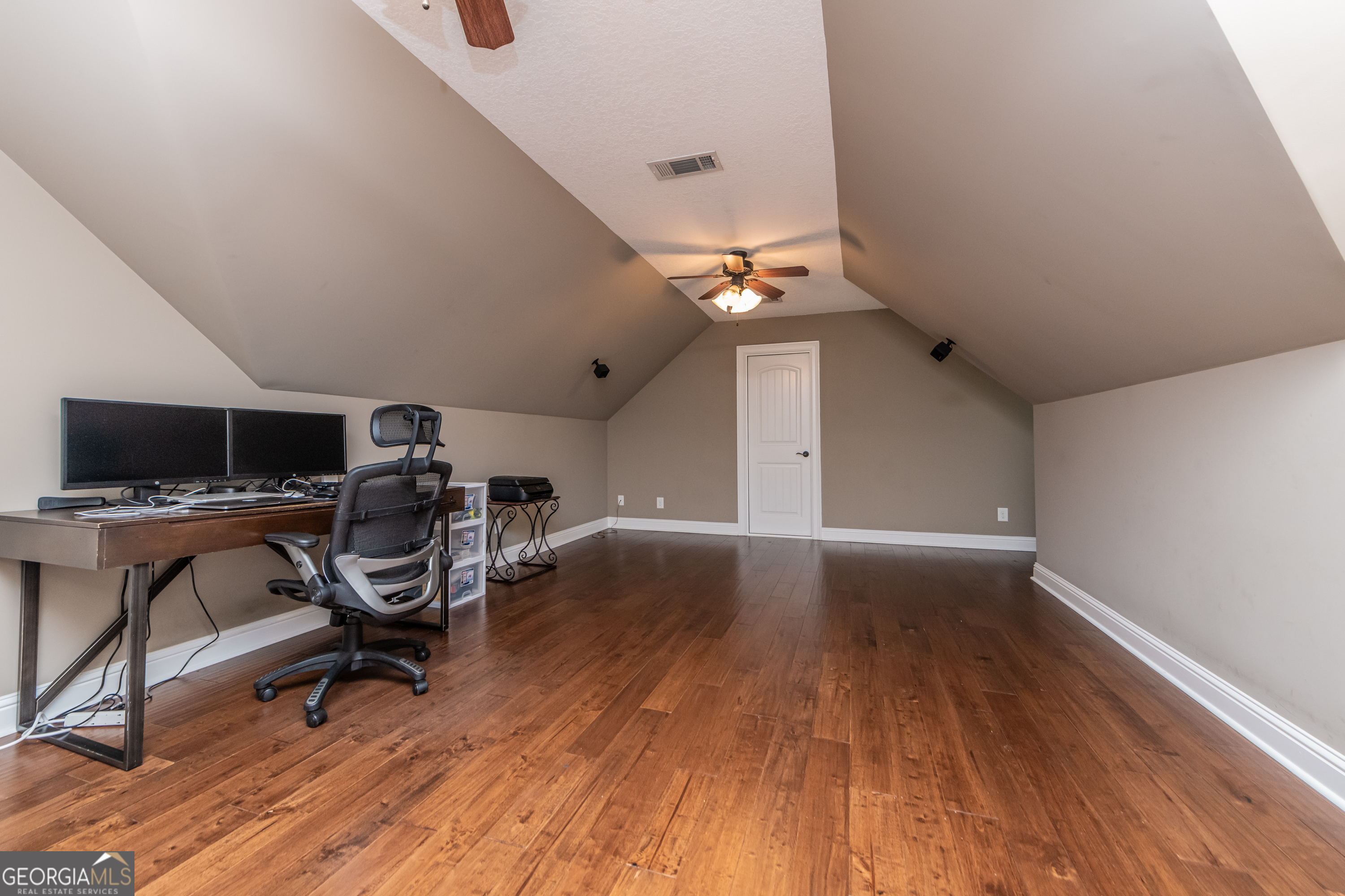 405 Old Bridge Road Warner Robins, GA 31088 - Photo 41 of 55 a view of a workspace with wooden floor and a window