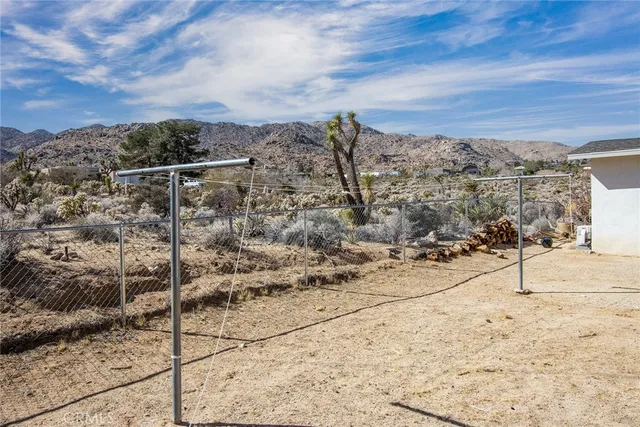 a view of a backyard of a house