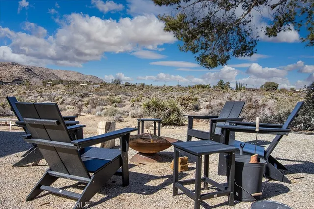 a view of a terrace with furniture and a stove