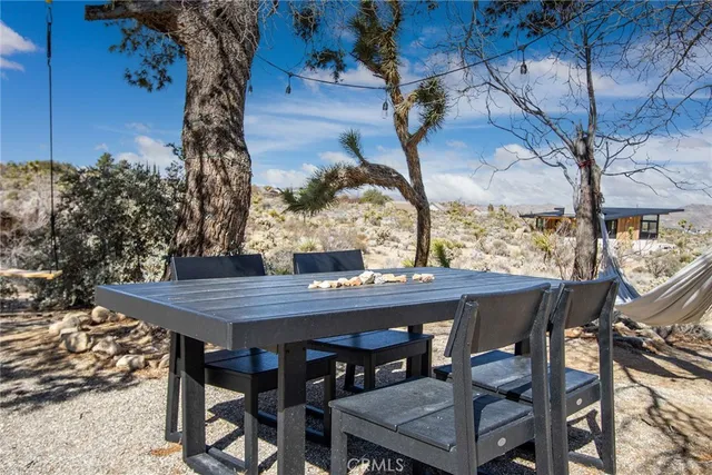 a view of an outdoor space with table and chair