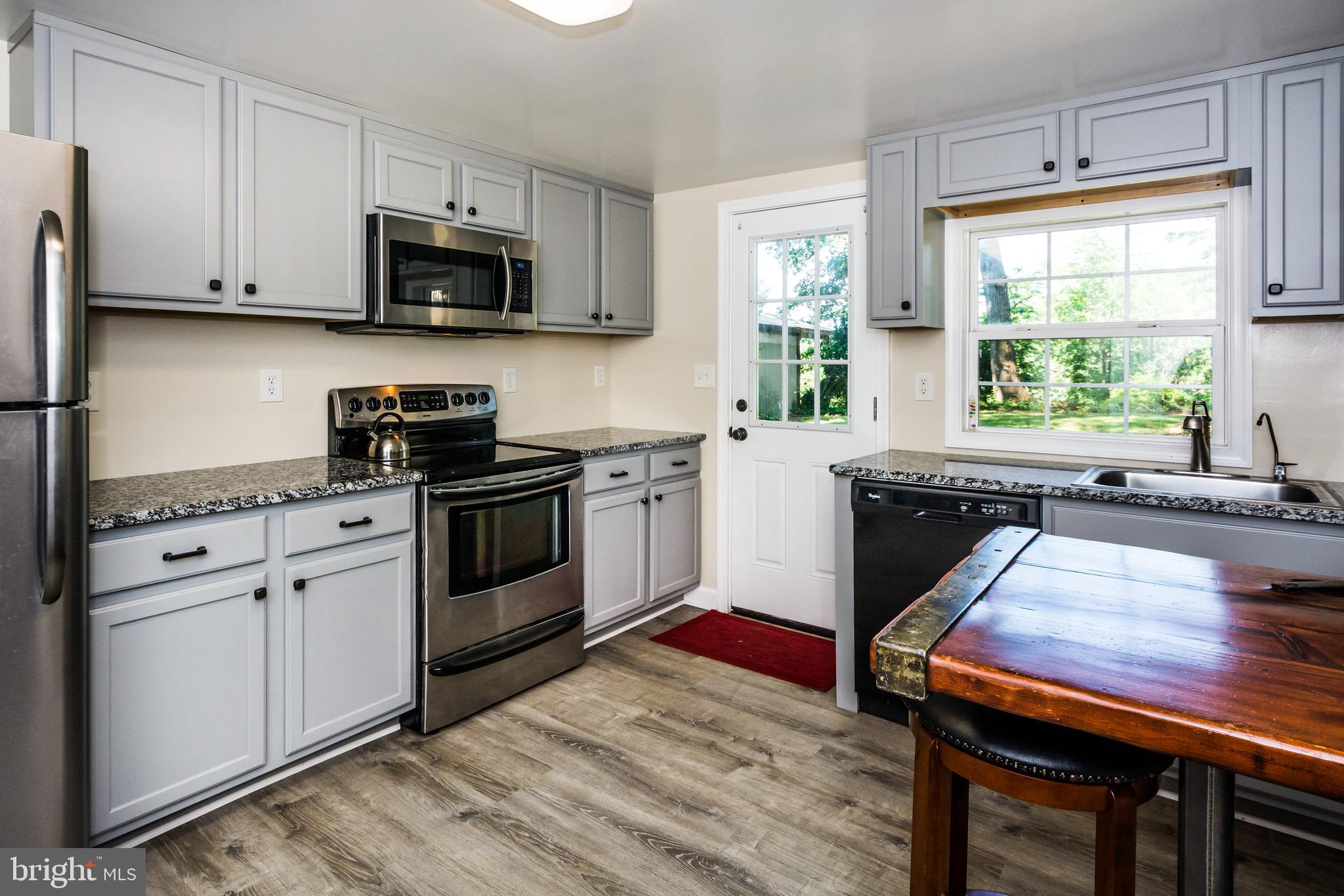 2712 Riverview Drive Riva, MD 21140 - Photo 11 of 34 Updated Kitchen with exit door to big back yard.