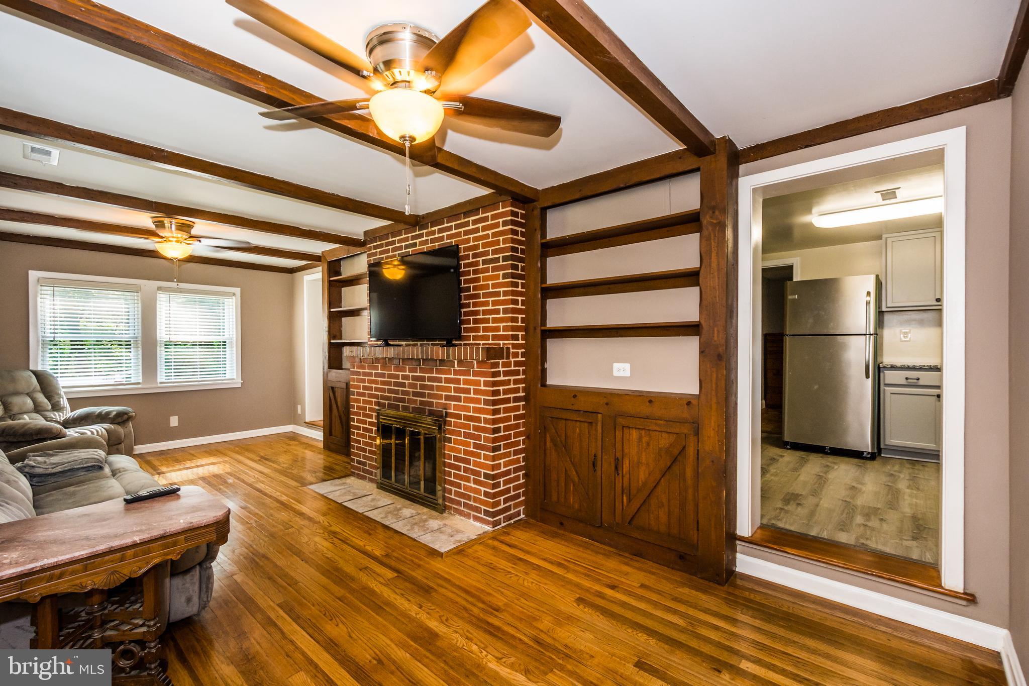2712 Riverview Drive Riva, MD 21140 - Photo 8 of 34 Living room view 3 with wood burning fireplace.