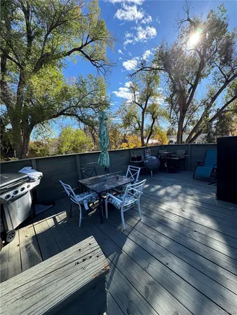 a backyard of a house with table and chairs