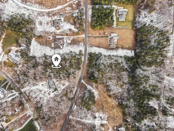 a aerial view of a house with a yard