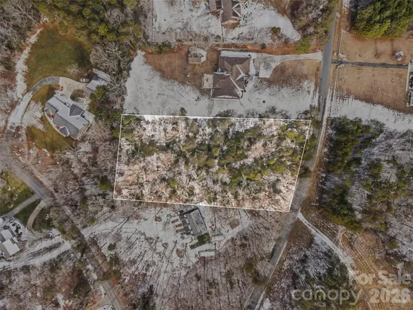 a aerial view of a house with a yard