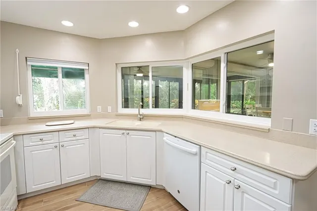a kitchen with sink and window
