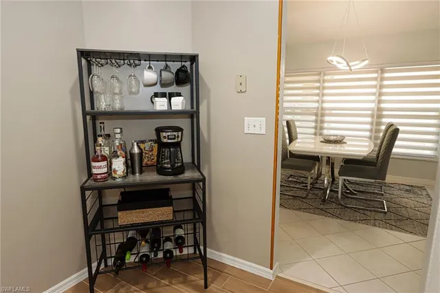 a view of a dining room with furniture and window