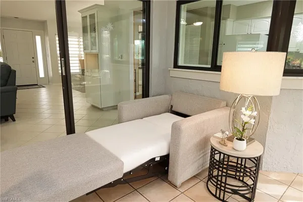 a dining room with a table and chairs