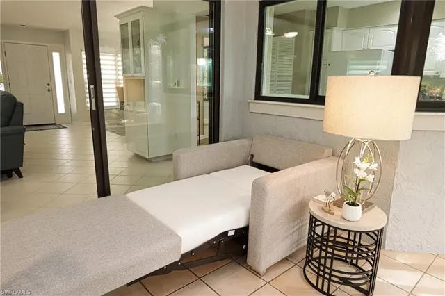 a dining room with a table and chairs