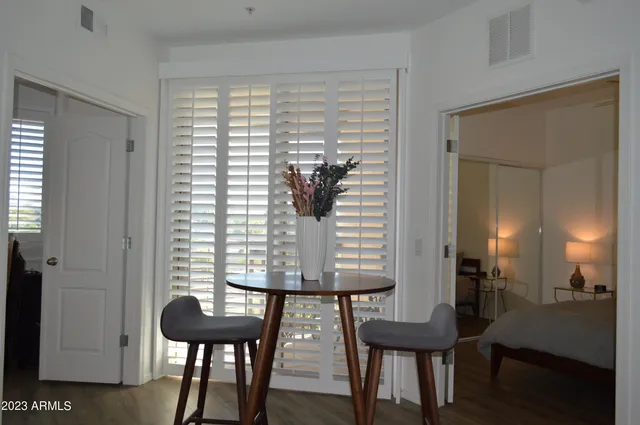 a bed room with a bed and a night stand