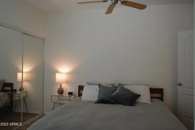 a bedroom with a bed and a couch