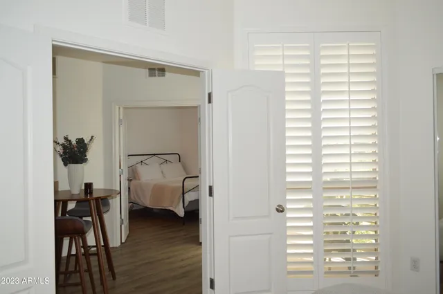 a bathroom with a sink a toilet a mirror and shower curtain