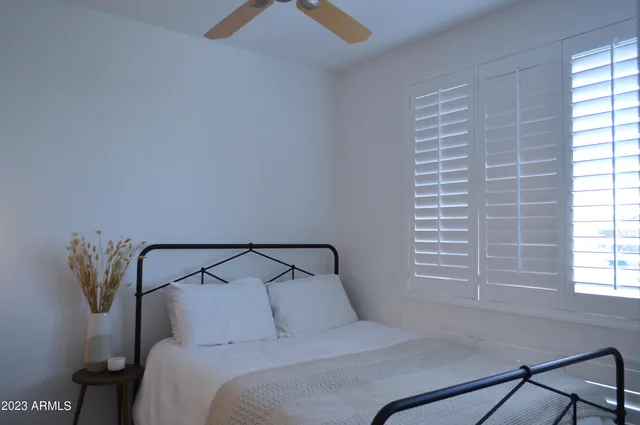 a view of a house with a tree in the background