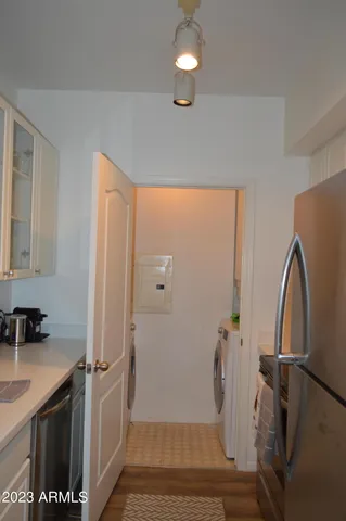 a view of a storage & utility room with a sink