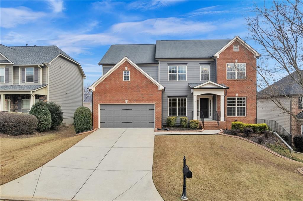 a front view of a house with a yard