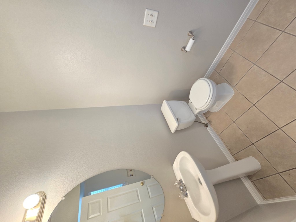 7509 Lazy Creek Drive, Unit B Austin, TX 78724 - Photo 16 of 20 Bathroom with light tile patterned floors and a textured wall
