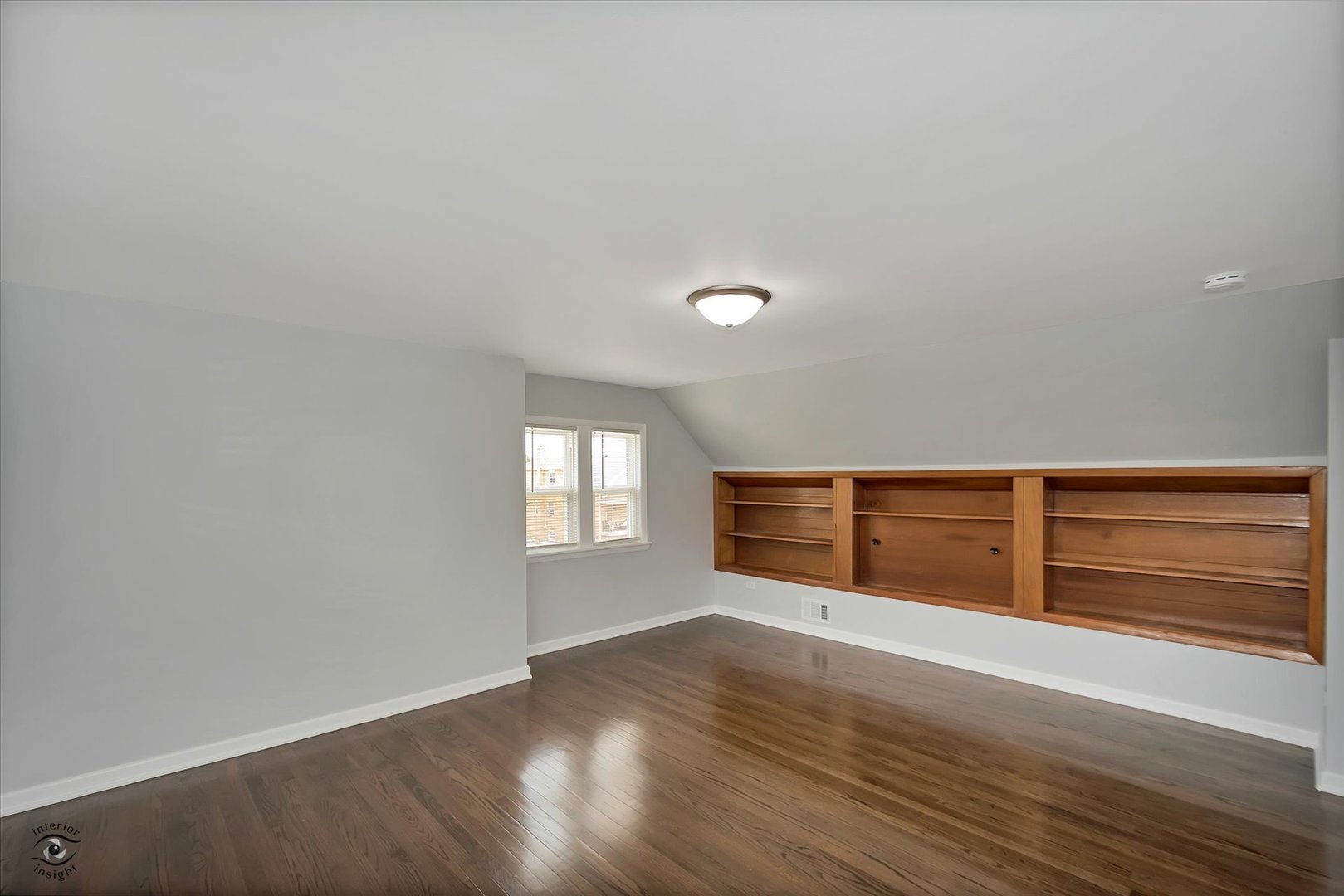 7229 57th Place Summit, IL 60501 - Photo 14 of 30 a view of an empty room with wooden floor and window