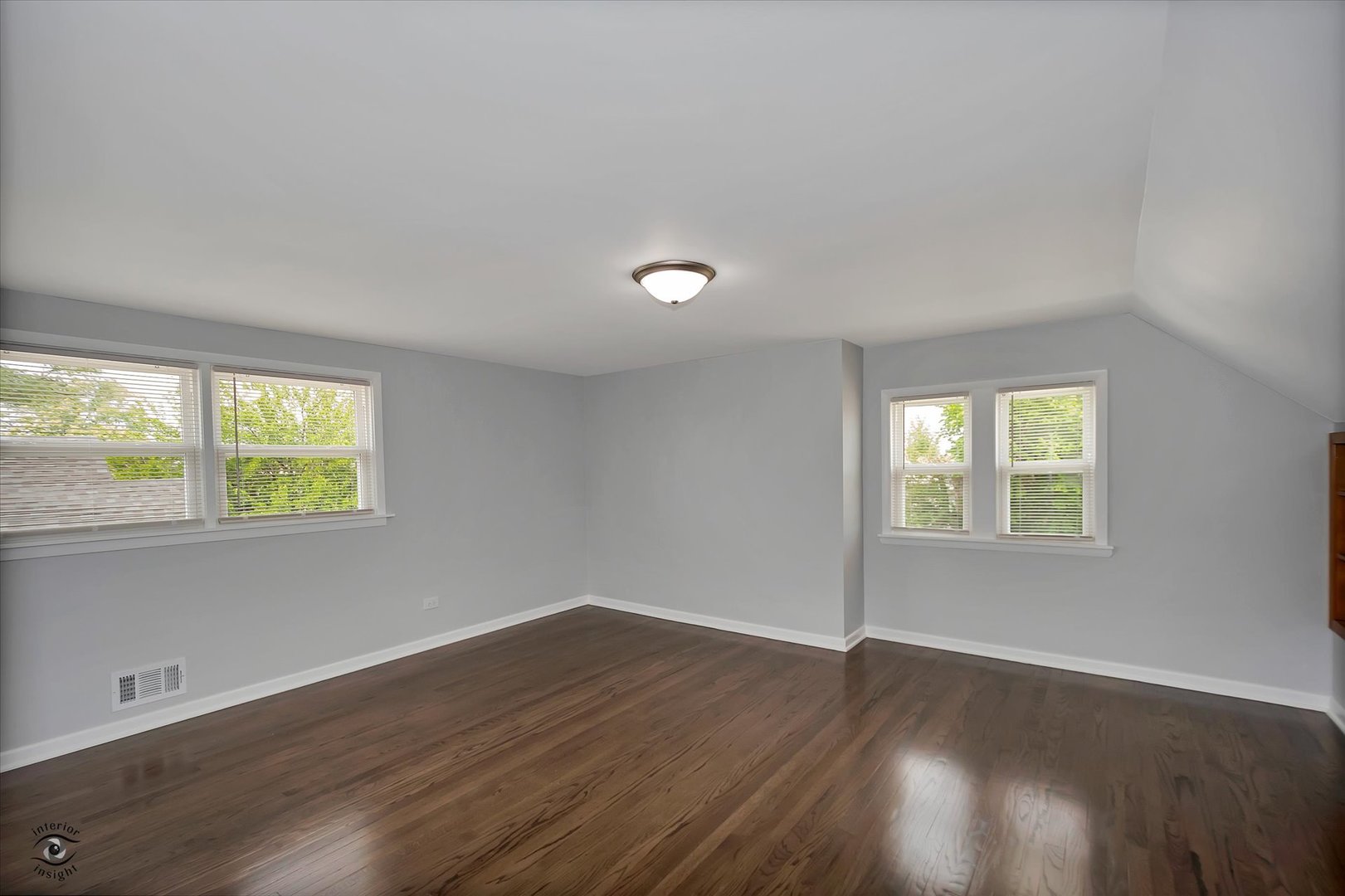 7229 57th Place Summit, IL 60501 - Photo 15 of 30 a view of an empty room with wooden floor and a window