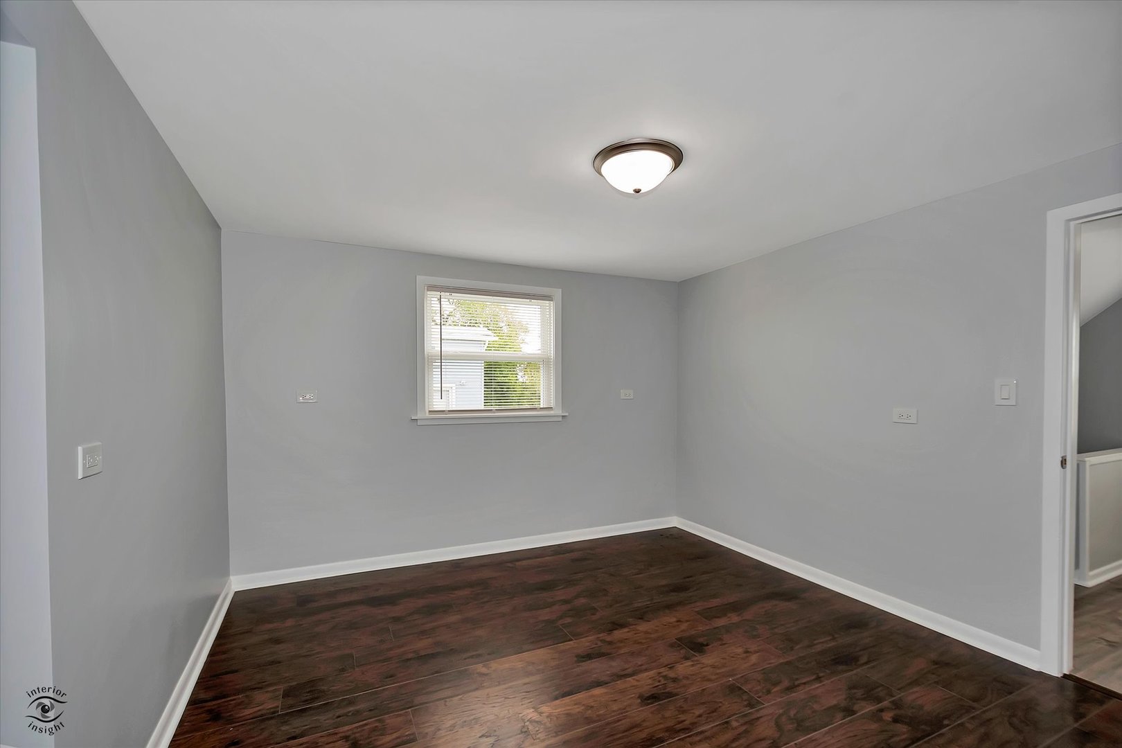7229 57th Place Summit, IL 60501 - Photo 17 of 30 an empty room with wooden floor and windows
