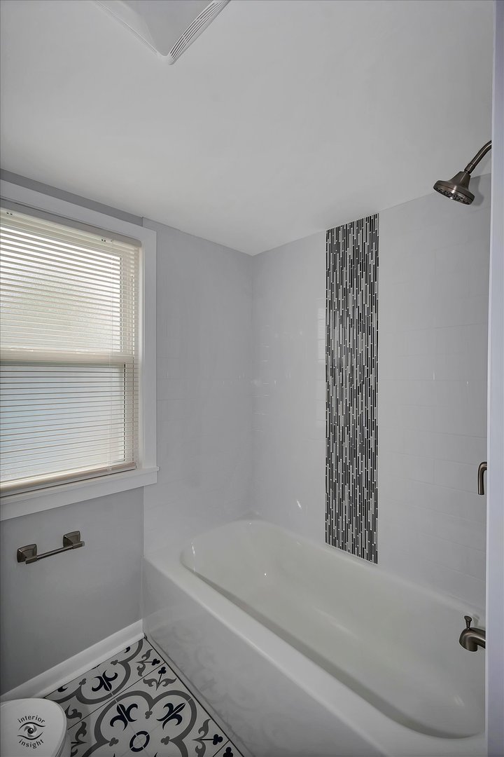 7229 57th Place Summit, IL 60501 - Photo 21 of 30 a bathroom with a bathtub and shower