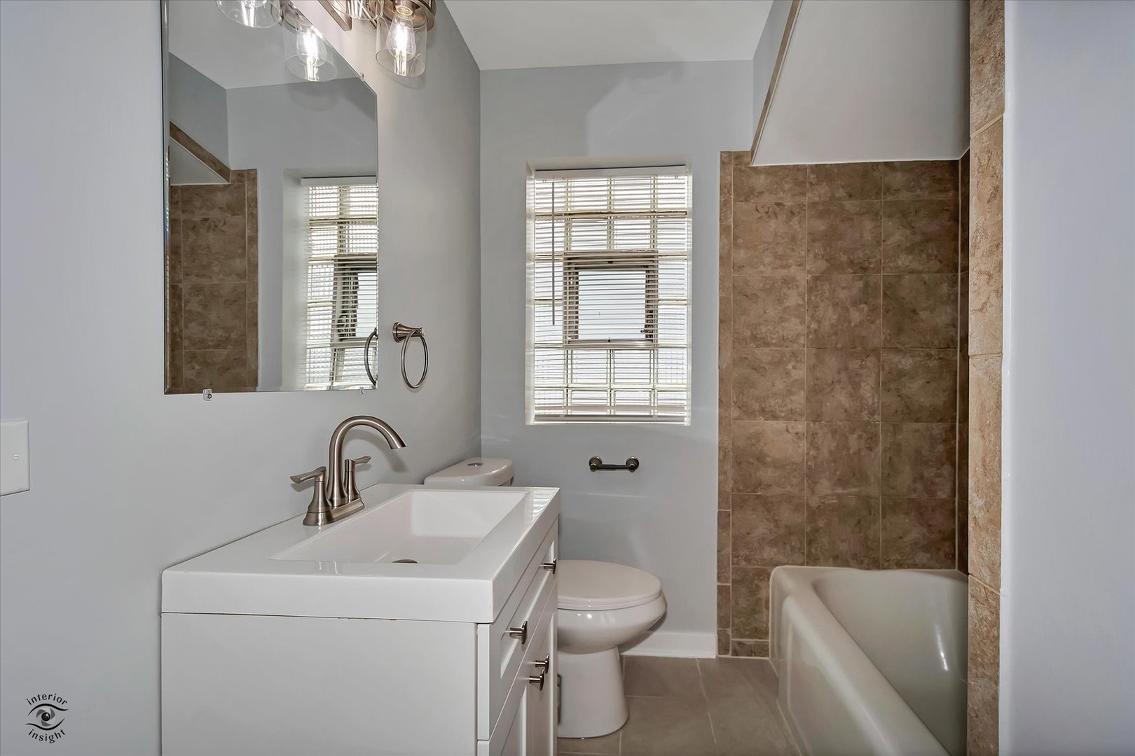 7229 57th Place Summit, IL 60501 - Photo 27 of 30 a bathroom with a toilet sink and bathtub