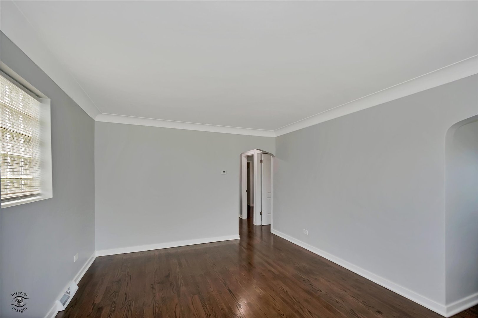 7229 57th Place Summit, IL 60501 - Photo 9 of 30 an empty room with wooden floor and windows