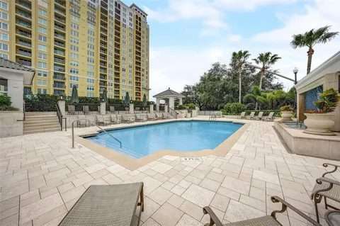 a view of swimming pool with outdoor seating