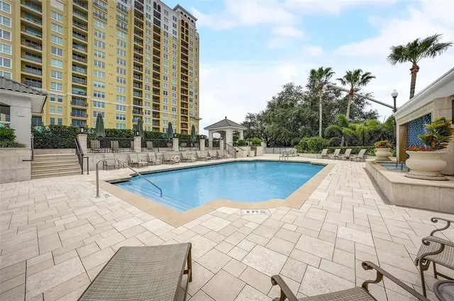 a view of swimming pool with outdoor seating