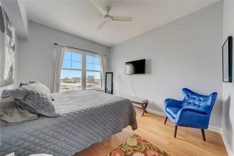 a view of a patio with couches table and chairs and potted plants