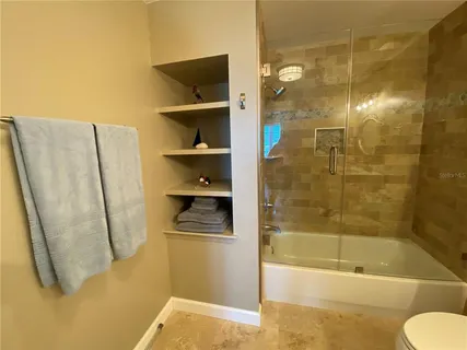 a view of a swimming pool with a lounge chairs