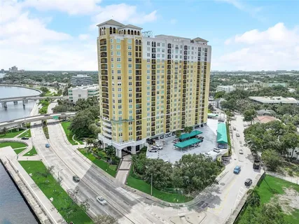 a lobby with furniture and floor to ceiling window