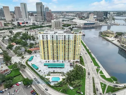 a room with furniture a flat screen tv and outdoor view