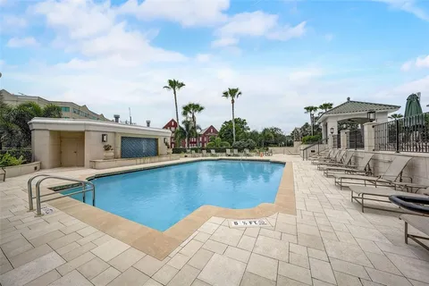a view of a tall building next to a road