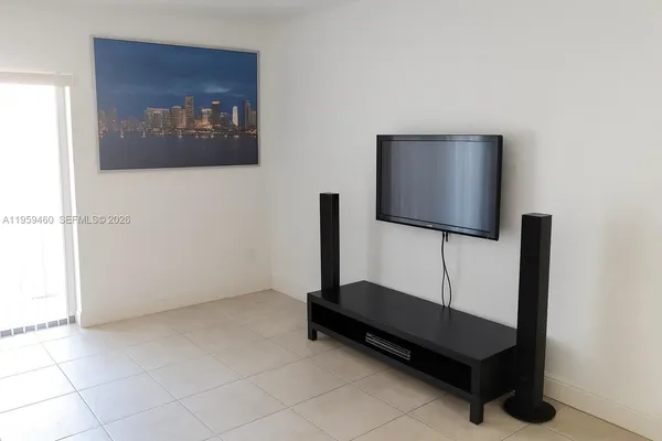 a living room with a couch and a flat screen tv