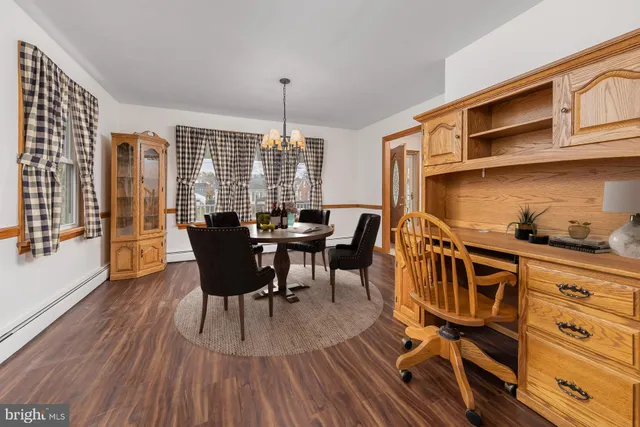 a kitchen with stainless steel appliances granite countertop a stove a sink a microwave a refrigerator and island