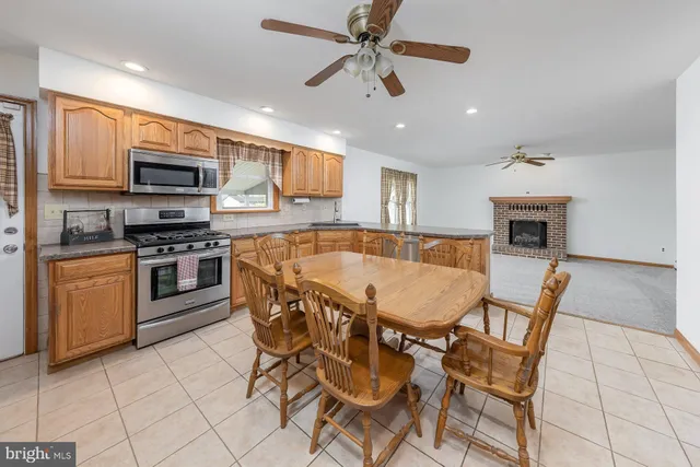a dining room with furniture and window