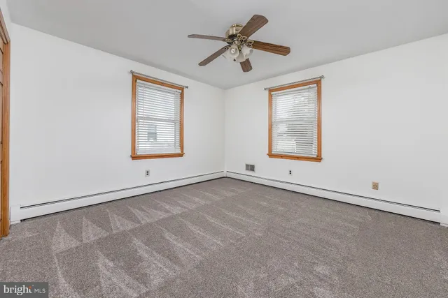 a bathroom with a sink toilet and a mirror
