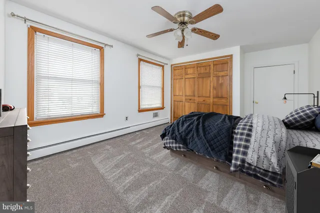 an empty room with windows and entrance