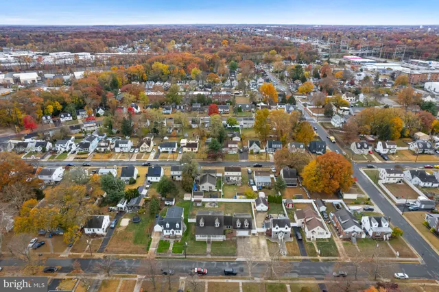 an aerial view of residential building with parking