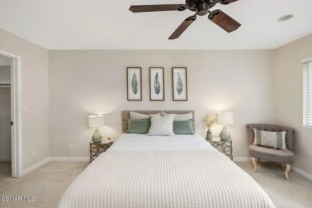 a bedroom with a bed and lamp