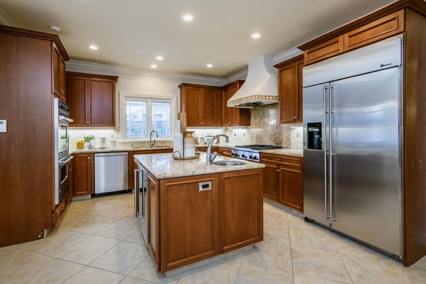 840 Newhall Road Burlingame, CA 94010 - Photo 12 of 41 a kitchen with stainless steel appliances granite countertop a refrigerator a sink a stove and a refrigerator