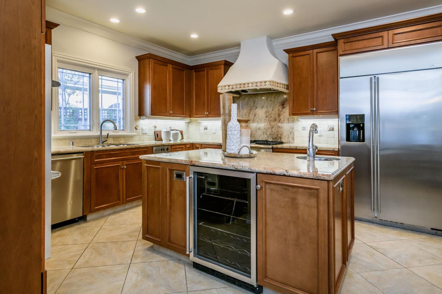 840 Newhall Road Burlingame, CA 94010 - Photo 13 of 41 a kitchen with stainless steel appliances granite countertop a sink stove and refrigerator