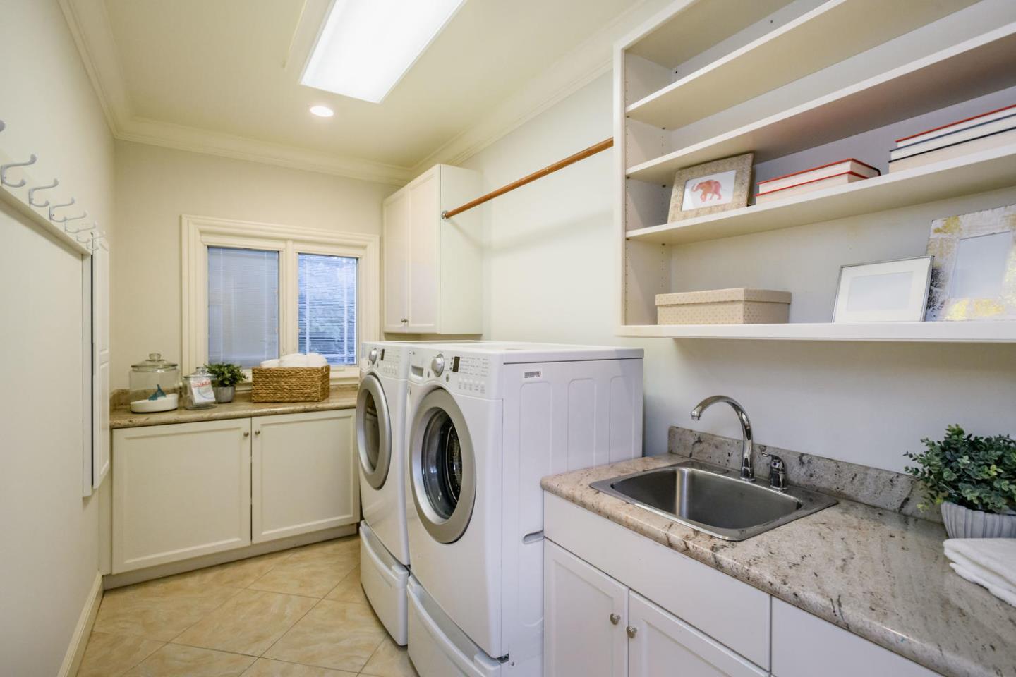 840 Newhall Road Burlingame, CA 94010 - Photo 17 of 41 a kitchen with a sink a washer and dryer